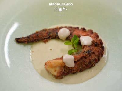 Double-cooked octopus tentacle on rosemary-infused cannellini bean cream with octopus "mayo"