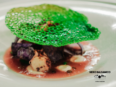 Grilled octopus on a bed of Taggiasca olives with fresh tomato gazpacho and crispy potato chips