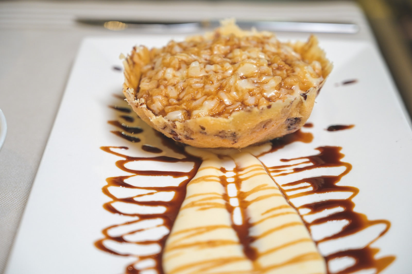 Black Rice Risotto with Balsamic Vinegar of Modena PGI in a crispy Parmesan wafer